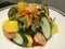Close-up healthy topical salad, prawn mango and assorted vegetable salad with dressing