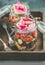 Close-up of healthy vegetarian salad in jars in wooden tray