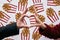 Close-up heart from hands at the street brand wall background with street food