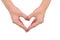Close up of heart made by women hands with pale skin isolated on