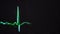 Close-up of heart`s cardiogram screen. Media. Green line moves at certain heart rate on black screen. Green line of