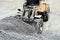 Close up of heavy duty large wheel loader loading gravel at work site