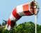 Close up heliport wind sock on drilling rig, blue sky background