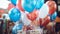 A close-up of helium-filled balloons in various adorned with \'Happy Birthday\' messages and tied to gift boxes