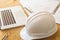 Close up of helmet with architect sketching a construction project