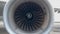 Close-up of an high-bypass turbofan Jet Airplane Engine rotating turning in the wind
