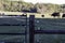 Close-up high tensile electric fence with cattle in background