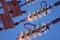 Close up of high voltage insulators at power-tower