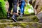 Close-up of hiker`s feet walking on rock