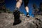 Close up of hikers legs, walking in rocky mountains