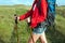 Close up of hiking young woman with backpack