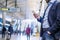 Close up of hipster businessman with smartphone, subway station