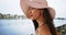 Close-up of a Hispanic woman looks off onto the bay