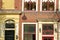 Close-up on a historical facade with carvings, located along Oude Delft Canal, Delft