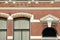 Close-up on a historical facade with carvings, located along Oude Delft Canal, Delft