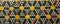 close up of historical horizontal colorful geometric pattern decorative stone floor background