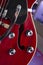 Close up of a hollow body red electric guitar