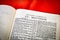 Close up of Holy Bible page, shallow depth of field with focus on book chapter, heading