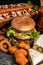 Close-up of home made tasty burger and hot dogs with fried chicken french fries. raditional American food. fast food