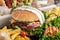 Close-up of home made tasty burger and hot dogs with fried chicken french fries. raditional American food. fast food