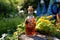 close-up of homemade amaretto bottle with garden backdrop
