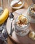 Close-up of homemade banana oats in a glass jar on wooden background