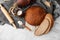 Close-up of homemade bread. Peasant round bread and wheat spikelets with space for text. Homemade baking. Sliced brown bread with