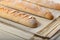 Close-up homemade fresh mouth-watering sourdough baguettes. Homebaked bread