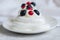 Close up of homemade individual meringue cakes Pavlova with whip