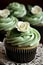 Close-up homemade sage green cupcake garnished with a cream swirl and a flower. Generative AI