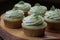 Close-up homemade sage green cupcake garnished with a cream swirl. Generative AI