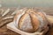 Close up of homemade whole grain sourdough bread on dark background