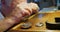 Close-up of horologist repairing a watch