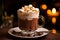 Close-up of hot chocolate glass topped with whipped cream and marshmallows over bokeh background. Hot drink consisting of grated