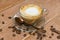 Close up of hot coffe cup with milk on a wooden background. latte or cappuccino on a table