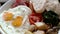 Close-up of Hotel Breakfast with Fried Eggs, Grilled Tomato and Mushrooms