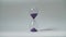 Close-up of an hourglass on a blurred background. Time lapse time is fleeting