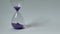 Close-up of an hourglass on a blurred background. Time lapse time is fleeting