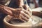 Close up human arms palms unrecognizable male female pottery master hands sculpt vase pot jug experienced workshop