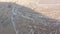 Close-up of human footprints in the wet sand at the seaside. Peace from the movement of sea water or waves