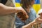 Close up of human hands making a clay mug. Pottery teaching class. Potter makes dishes from clay, ceramics