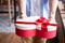 Close up of human hands receiving a decorative present gift with