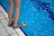 Close up human legs swimmer fins near pool