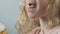 Close-up of hungry kid munching on freshly baked muffin, appetizing bakery