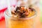 close up of ice cold Longan fruit juice in glass with straw on old table