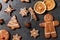 close up of iced gingerbread on black table top