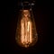 Close-up of illuminated Edison light bulbs in darkroom