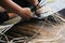 Close-up image of asian female hands tailor manual working sewing crafting at textile factory