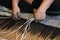 Close-up image of asian female hands tailor manual working sewing crafting at textile factory