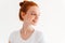 Close-up image of beauty ginger woman in t-shirt looking away